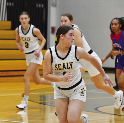 Left: Giselle Mora takes the ball to the basket for an easy layup. Above: Kara Kram sprints back on defense after scoring on offense. COURTESY PHOTOS