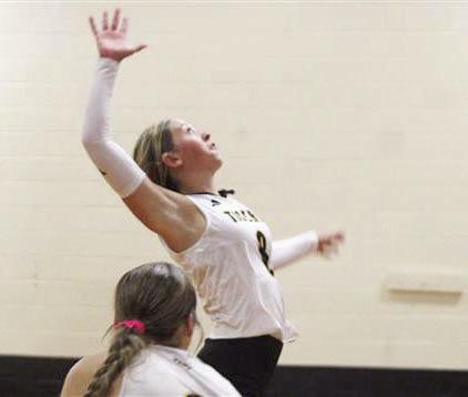 Ryanne Meyer slams down a spike to earn a point for the Lady Tigers