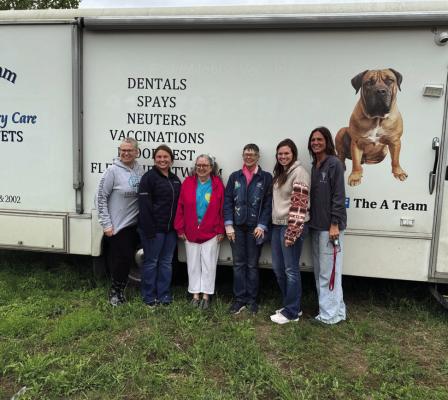 Dr. Amy Walzel, veterinary techs, and volunteers