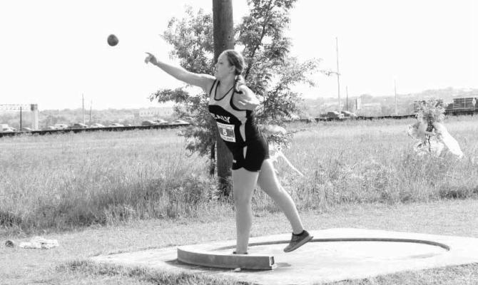 Addison Holub throws the shot put for the Sealy Unified track team. COURTESY PHOTOS