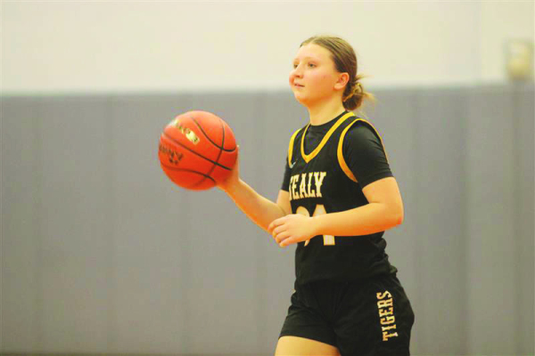Hailey Svoboda carries the ball and scans the floor for an open teammate.