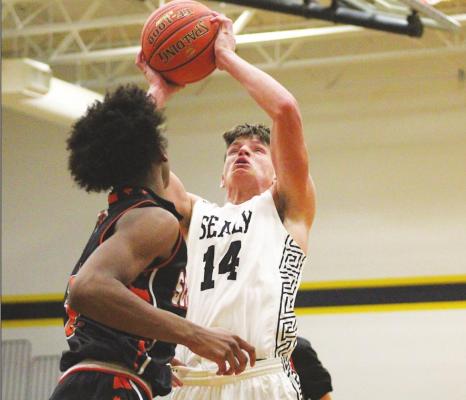 Sealy senior Lane Holley lines up a contested shot against Schulenburg in non-district action at home on Dec. 12, 2020. Holley and the Tigers will open district play on the road on Jan. 12. Cole McNanna