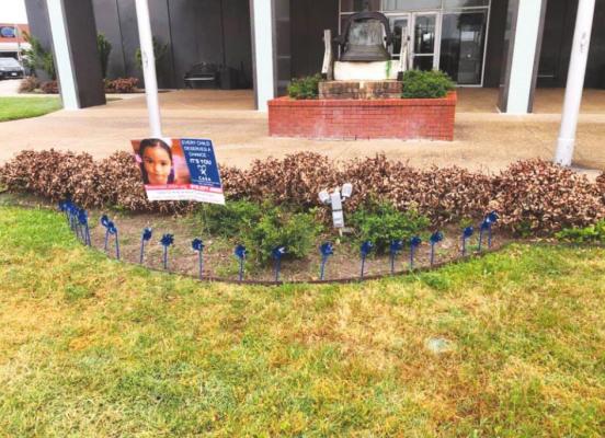 The Austin County courthouse’s exterior was decorated with blue ribbons Monday morning in honor of April’s Child Abuse Prevention Month. Locally in Austin County last year, 47 children were victims of abuse and neglect and one child died due to abuse and neglect.