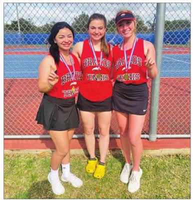 Brazos tennis players Micha Alvarado, Caitlyn Snedaker (girls’ doubles) and Meagan Demny (girls’ singles) earned first place in their respective brackets at March 30’s District 24-3A Championship in Wharton. The trio competed in the regional tournament earlier this week. CONTRIBUTED PHOTO