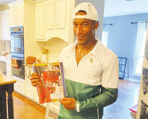 Bellville senior Richard Reese shows off his picture inside this year’s Dave Campbell’s Texas Football Magazine entering his final high school season. CONTRIBUTED PHOTO