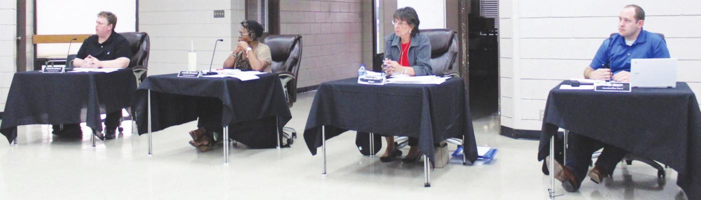 HANS LAMMEMAN Edward Zapalac, Yvonne Johnson, Carolyn Bilski and Chris Noack focused their attention during the City Manager’s report during Tuesday’s regular meeting Sept. 21 at the W. E. Hill Community Center.