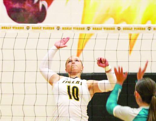 Jade Barton tips the ball past a defender to earn a point for the Lady Tigers. SEALY NEWS | EVAN HALE