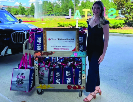 BMW of Houston North Sales Associate Bailey Wolcott visits Texas Children’s Hospital as part of AutoNation’s year-round commitment to drive out cancer through DRV PNK. Associates packed and delivered 25 Totes for Hope for pediatric cancer patients.