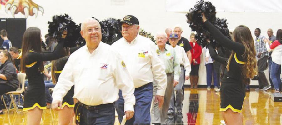 Local veterans enter Sealy High School’s Veteran Day Celebration Nov. 11, 2019, through a gauntlet of SHS cheerleaders. Servicemembers are once again invited to this year’s assembly but are encouraged to RSVP before Nov. 5 if interested in the luncheon. COLE McNANNA