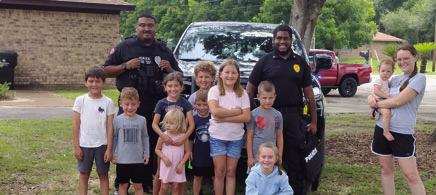 Wallis Police Officers Chase Tyler and Roberto Govea read books to the kids. This was followed by a question-and-answer period. The kids asked some good questions like “Does your vest weigh a lot?”The kids then went outside and were able to look at and sit in the police vehicles.