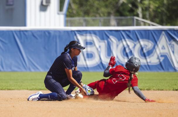 Blinn’s Bella De Los Santos applies a tag to a baserunner during a recent contest. COURTESY PHOTO
