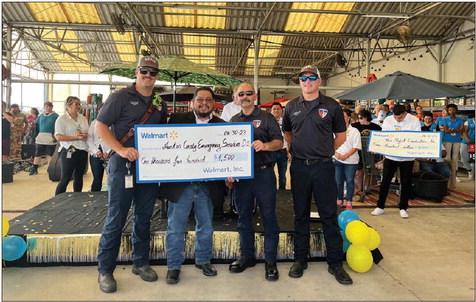 Walmart Sealy donated a $1,500 community grant to Austin County Emergency Services District No. 2. Walmart manager Joe Cervantes, second from left, presented the check to ESD representatives. COURTESY PHOTO