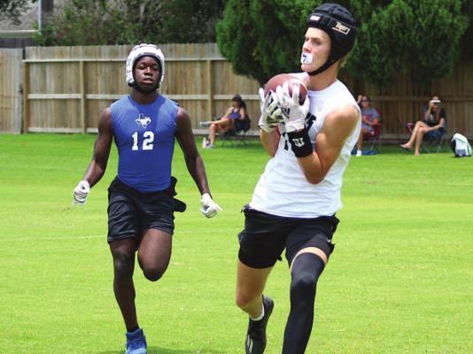 Sealy receiver Parker DeBerry is led into the end zone after a pass from quarterback D’vonne Hmielewski during the Tigers’ 7-on-7 game against Taylor Wednesday, June 30.