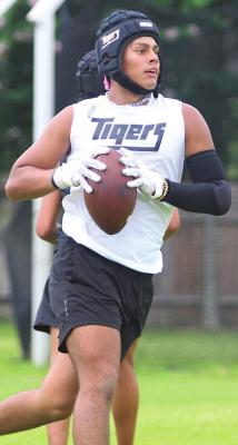 Tiger senior Jonathan Monterroza secures a touchdown pass from classmate Connor Krenek which served as Sealy’s final score in the Katy Taylor passing league Wednesday, June 30.