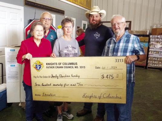 Sealy Knights of Columbus Co. 3313 presented a check for $475 to the Sealy Christian Pantry which were a part of designated proceeds from their recent Grilled Pork Steak Drive-thru Dinner. In the photo, left to right, Jane Gipson, Pantry Secretary, Joe J. Marusik, KC Financial Secretary, Patsy Tomasek, Pantry President, Dustin Konesheck, KC Grand Knight and Dennis Dailey, KC Trustee.