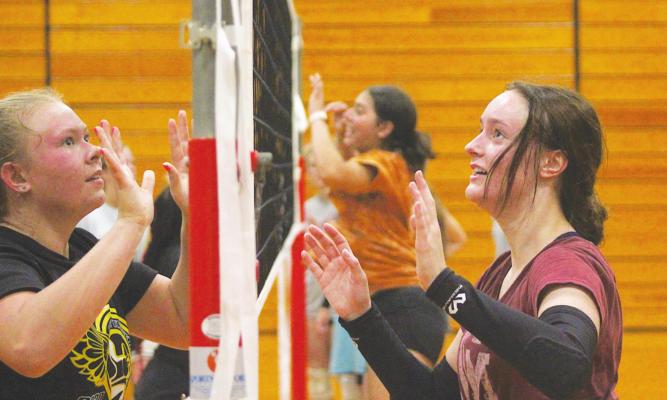 Sealy High School seniors Julia Jurecka and Kenna Killough participate in a drill during sport-specific skill training July 12 at Sealy Junior High School. COLE McNANNA