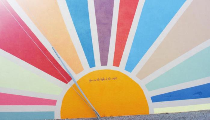 The completed mural brings a surge of color to the downtown district.