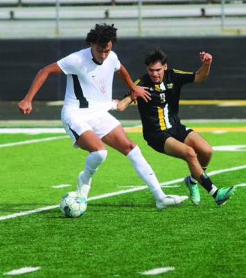 Israel Santos pressuring the St. Thomas player forcing a turnover. SEALY NEWS | EVAN HALE