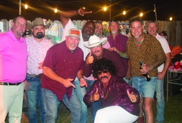 Part of the lure for Bras for a Cause are area businessmen that appear on stage in bras that are auctioned off during the evening. This year, the event will celebrate its 10th year in service in raising funds for breast cancer awareness. SEALY NEWS FILE PHOTO