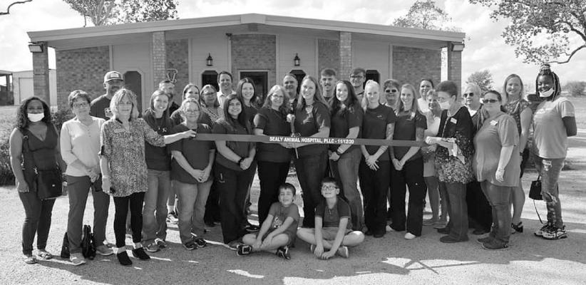 The Sealy Chamber of Commerce joined the staff of Sealy Animal Hospital recently for a ribbon-cutting ceremony. Staff members in maroon shirts picted from the left are Andrea, Debbie, Cassie, Alex, Kathy, Dr. Kimberly Clark owner, Dr. Nicole Oberle owner, Hunter, Molly, Polly and Ashley. Contributed photo
