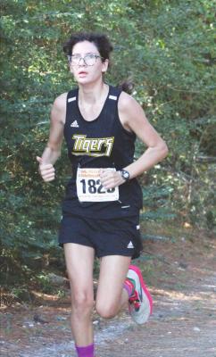 Lady Tiger freshman Ria Torres runs the course in Huntsville for the Region III Championship Oct. 25. COURTESY PHOTOS