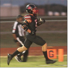 Luke Polasek runs in a touchdown during a game against Schulenburg on Sept. 19, 2025, at Wallis Brazos High School.