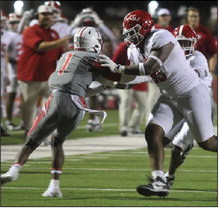 Don Gillum tries to fight off a blocker during a game against Columbus on Friday, Sept. 26, 2025, at Bellville High School. PHOTOS BY SEALY NEWS | EVAN HALE