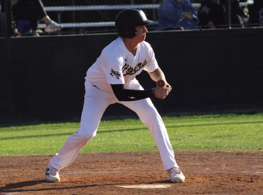 Hagen Anderson lays down a bunt for the Sealy Tigers. PHOTOS BY SEALY NEWS | EVAN HALE