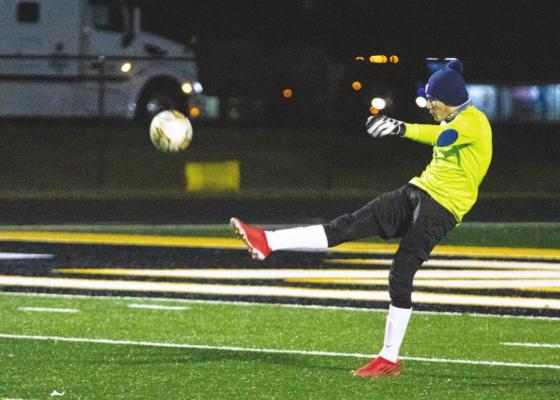 Sealy senior Brayan Aviles launches a ball downfield after making a save in the first half of the Tigers’ district battle with Discovery last Friday at home.