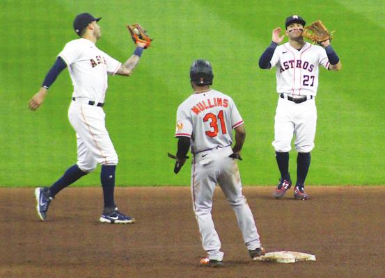 Astros shortstop Carlos Correa (1) reels in a pop fly while second baseman Jose Altuve (27) stands idly by during Houston’s game against Baltimore June 30 at Minute Maid Park. The pair were named to the Midsummer Classic Sunday. COLE McNANNA