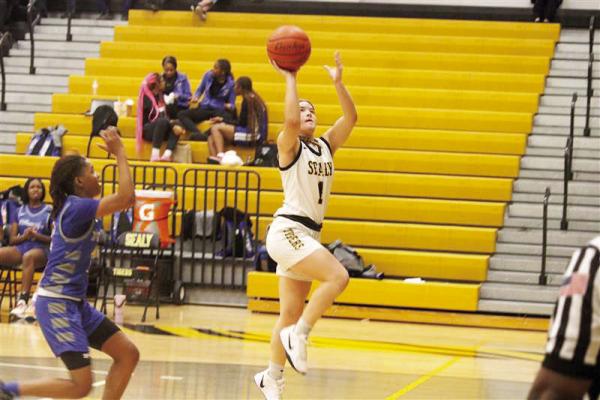 Kara Kram elevating to score an easy layup.