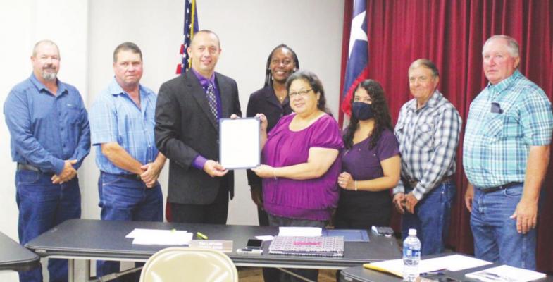 HANS LAMMEMAN The Austin County Commissioner’s Court officially proclaimed October as Domestic Violence Awareness Month and posed with members of Focusing Families during the regular meeting Monday, Oct. 11.