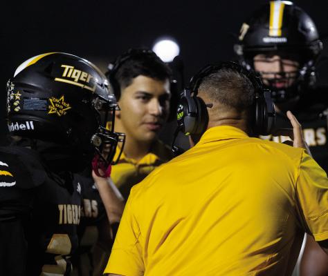 Sealy Head Football Coach Clint Finley talks with his players during a timeout during last Friday’s big win over La Marque. PHOTOS BY ABENEZER YONAS