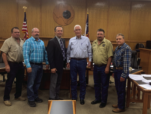 Steve Lacky was appointed by the Austin County Commissioners Court as the new county’s veteran's representative. From left are Precinct 3 Commissioner Leroy Cerny, Precinct 4 Commissioner Chip Reed, Austin County Judge Tim Lapham, Lackey, Precinct 1 Commissioner Greg Mikel and Precinct 2 Commissioner Bobby Rinn. PHOTO BY JIMMY GALVAN/SEALY NEWS