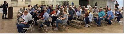 Austin County Judge Tim Lapham addresses a crowd of over 100 Austin County residents and stakeholders at a public hearing for a moratorium on data center and battery energy storage systems, Monday, July 13, at the Austin County Fairgrounds in Bellville. THE SEALY NEWS | ALLISON DRINNON
