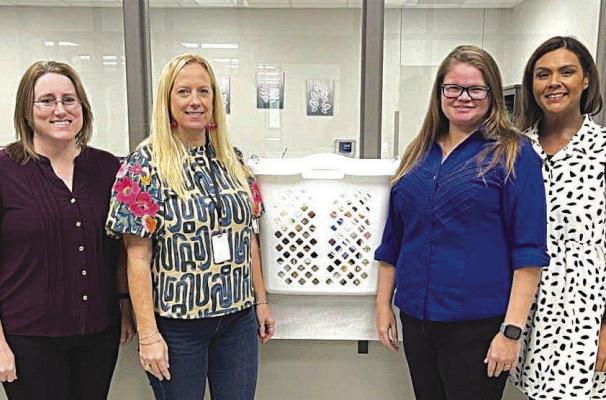 Pictured, left to right, are Assistant District Attorney Brandy Robinson, DA Chief Legal Assistant Lisa Tobola, Focusing Families Nikki Alley, DA Office Administrator Maribel Cruz.