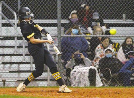Sealy senior Brooke Kram lifts a sixth-inning double as part of a four-hit night that helped the Lady Tigers take down Legacy in non-district action 15-7 last Tuesday at home. PHOTOS BY COLE McNANNA