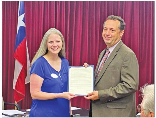 Mandy Wright, Executive Director for CASA For Kids of South Central Texas, was presented a proclamation from Austin County Judge Tim Lapham announcing April as Child Abuse Awareness and Prevention month during the regular Commissioners Court meeting Monday, April 11. RAE DRADY