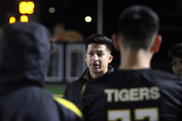 Assistant Coach Alex Dominguez highlights what his team has to work on at halftime and motivates the boys to push harder.