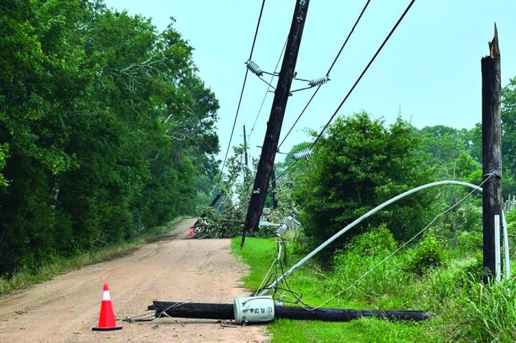 All throughout the Raccoon Bend area, power lines can be found down along streets and houses as residents in the area had to endure the hot weather without electricity for the past week. COURTESY PHOTO