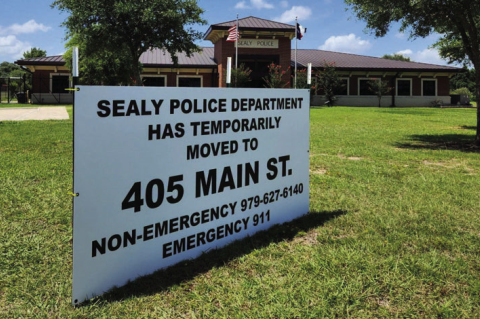 A sign announcing the temporary move of the Sealy Police Department sits outside its building. COURTESY OF SEALY PD FACEBOOK