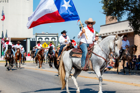 The Coshatte Amigos prance on horses during the Austin County Fair opening parade, Thursday, Oct. 9, through Bellville. Sealy News | Allison Drinnon
