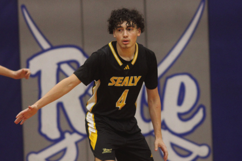 Ian Aguilar keeps his hands up and ready on defense during a game against Boling at the Rice Consolidated High School basketball tournament on Dec. 4. SEALY NEWS | EVAN HALE
