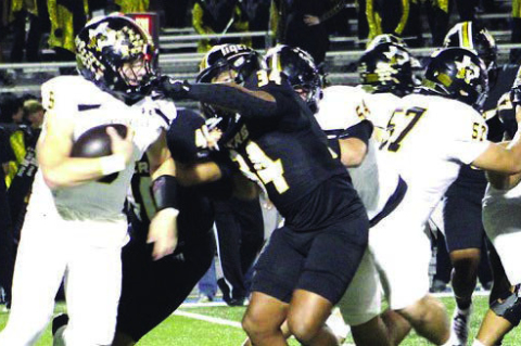 The Sealy Tigers defense breaks through the line to secure a tackle for loss against Gatesville in the bi-district round of the playoffs on Friday, Nov. 14, 2025, at Rockdale High School. PHOTOS BY HERBIE KOLLATSCHNY