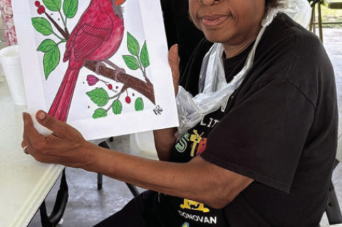 Hazel Bolden holds the painting she completed at the Sealy Eastside Foundation Paint &amp; Picnic event last week.