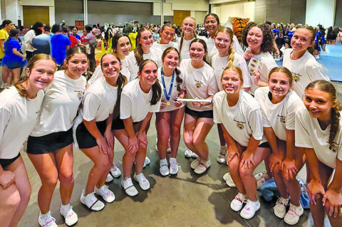 The Sealy cheer squad pose for a picture with the spirit stick during the UCA Camp at the University of Texas at San Antonio on July 19-24. COURTESY PHOTO
