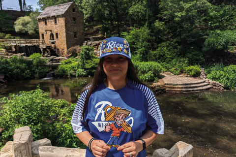 Abigail Hernandez holds up “Lil Johnny,” the logo for Johnny B Good Lock &amp; Safe, in front of the Old Mill in Arkansas. Abigail was on her way to Williamsport, PA for the Maria Pepe Legacy Series. COURTESY | JOSEPH HERNANDEZ