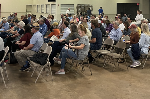 Austin County Judge Tim Lapham addresses a crowd of over 100 Austin County residents and stakeholders at a public hearing for a moratorium on data center and battery energy storage systems, Monday, July 13, at the Austin County Fairgrounds in Bellville. THE SEALY NEWS | ALLISON DRINNON