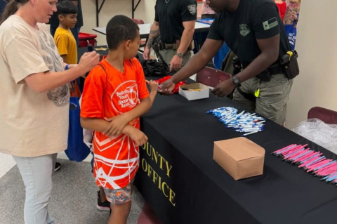 Members of the Austin County Sheriff’s Office and Youth and Family Services served the community during the Back-To-School Fair last week at Bellville High School. COURTESY PHOTO