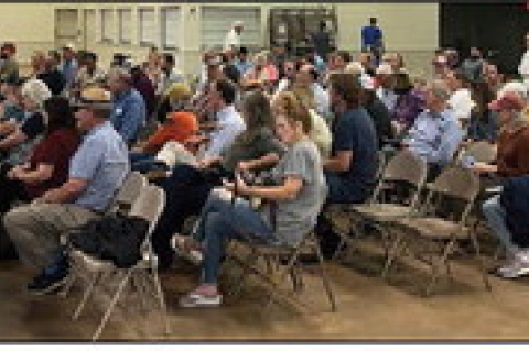 Austin County Judge Tim Lapham addresses a crowd of over 100 Austin County residents and stakeholders at a public hearing for a moratorium on data center and battery energy storage systems, Monday, July 13, at the Austin County Fairgrounds in Bellville. THE SEALY NEWS | ALLISON DRINNON